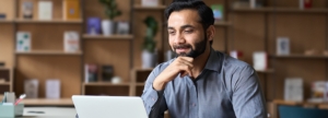 Man reviewing contracts on his computer