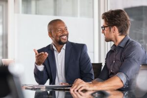 Federal government employees discussing small businesses. 