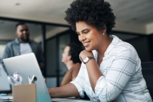 Woman working on her laptop.